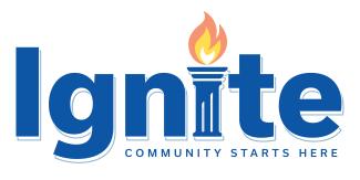 Word "ignite" in bold blue. Second letter "I" is a cartoon greek-style column with torch coming out of the top. Under the large word "ignite" is a sentence reading, "Community Starts Here."